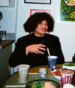 A student laughing during a conversation at Alpha
