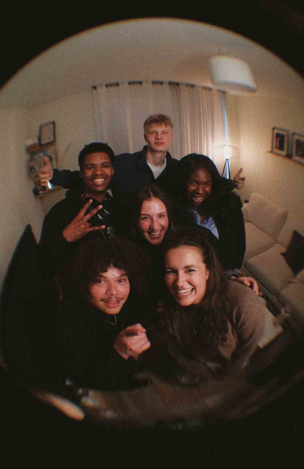 A group of students laughing together at an Alpha session